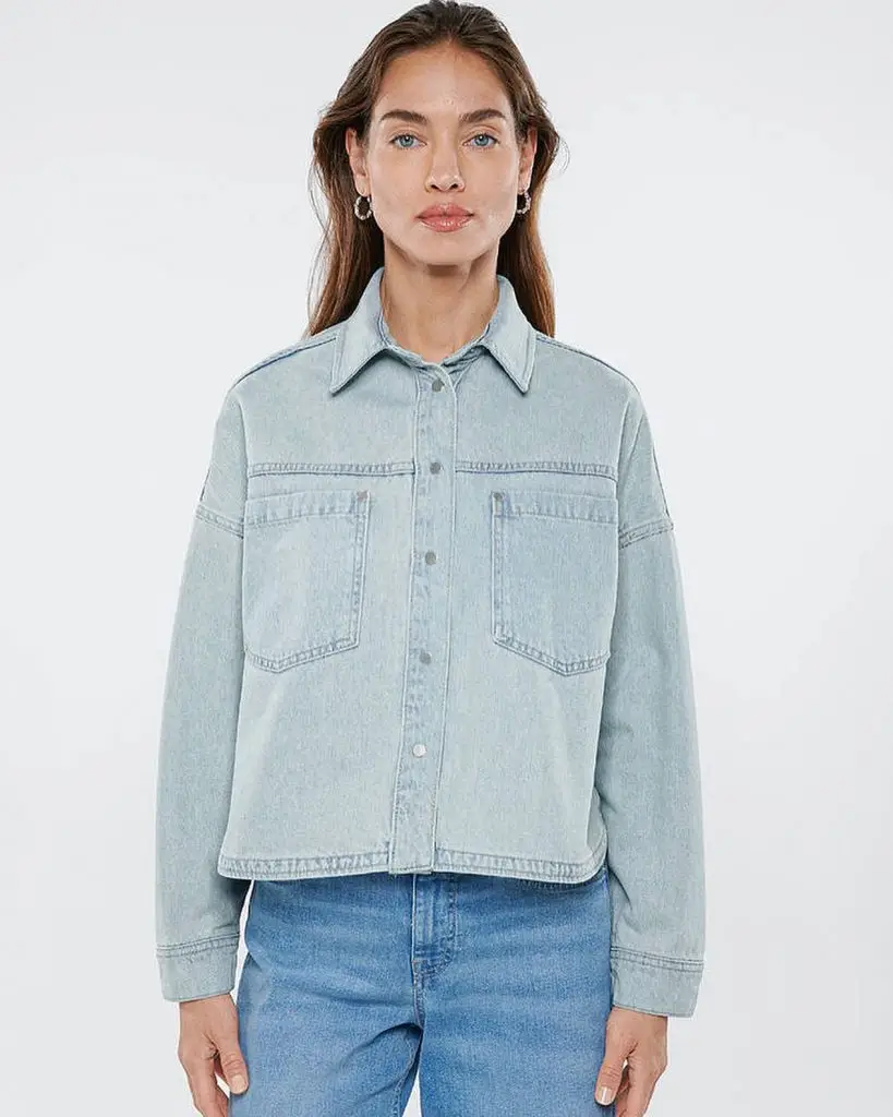 Light denim jacket featuring bold neon-painted geometric shapes
