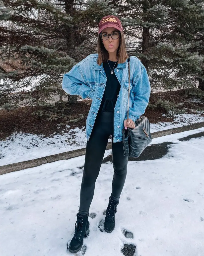 Denim jacket with fringe detailing along the sleeves and back