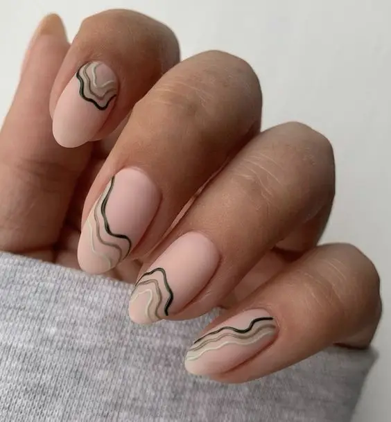 Modern Valentine’s Day nails with glitter accents and soft pink base