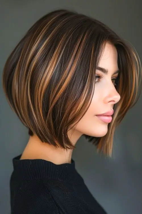 Chocolate brown hair with strawberry blonde highlights and loose curls