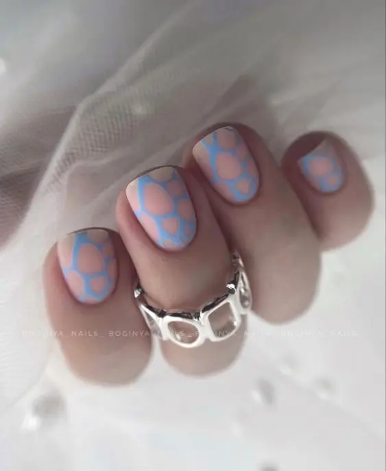 Pink marble Valentine’s Day nails with gold veining details