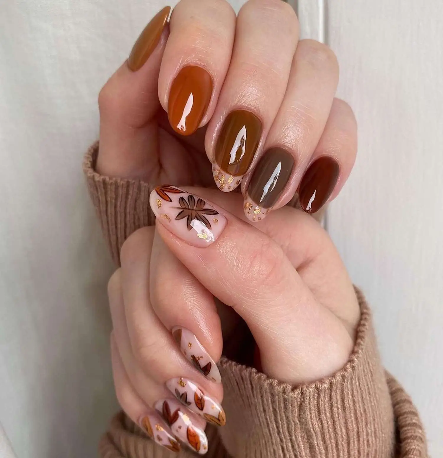 Nude Valentine’s Day nails with tiny red hearts sprinkled delicately across