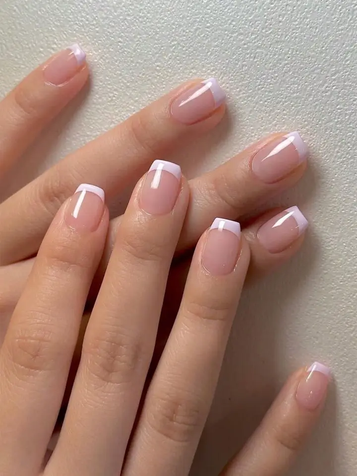 Short acrylic nails in matte taupe with minimalist white line art accents
