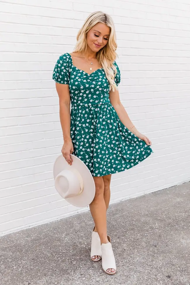 Cream sweater and plaid skirt for Saint Patrick's Day outfit idea