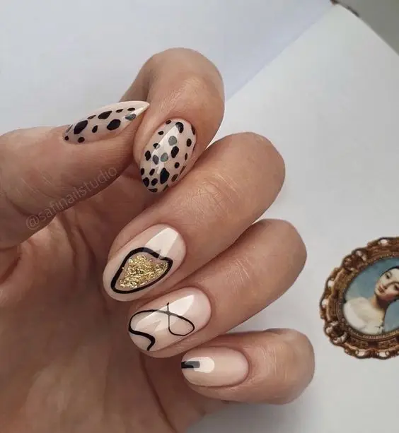 Pastel Valentine’s Day nails with floral accents and glossy finish