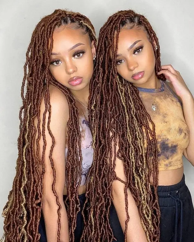 Goddess cornrows adorned with shell beads for a coastal-inspired aesthetic