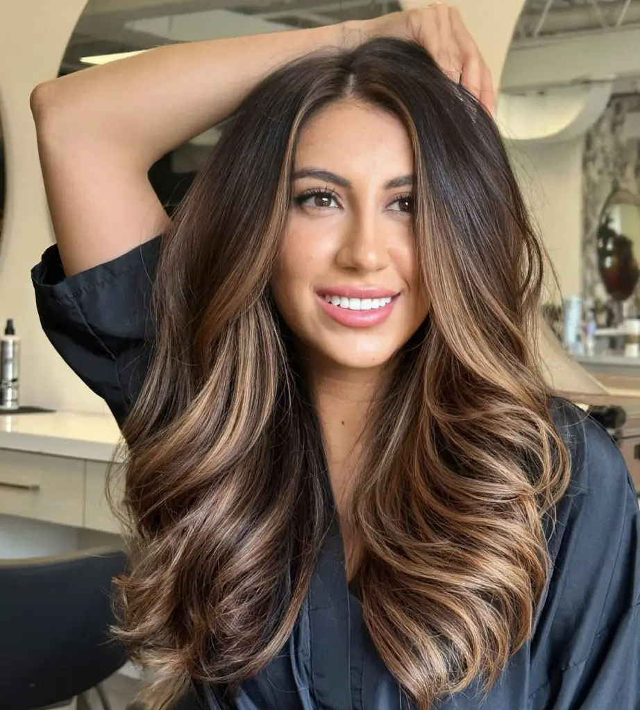 Toffee and honey caramel highlights on wavy hair
