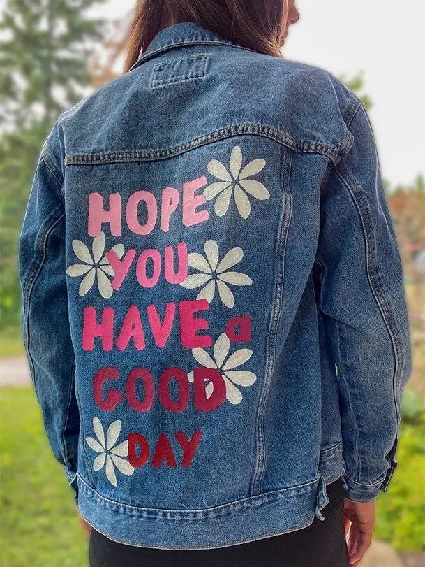 Lightwashed denim jacket adorned with fringe and sequin layers across the back