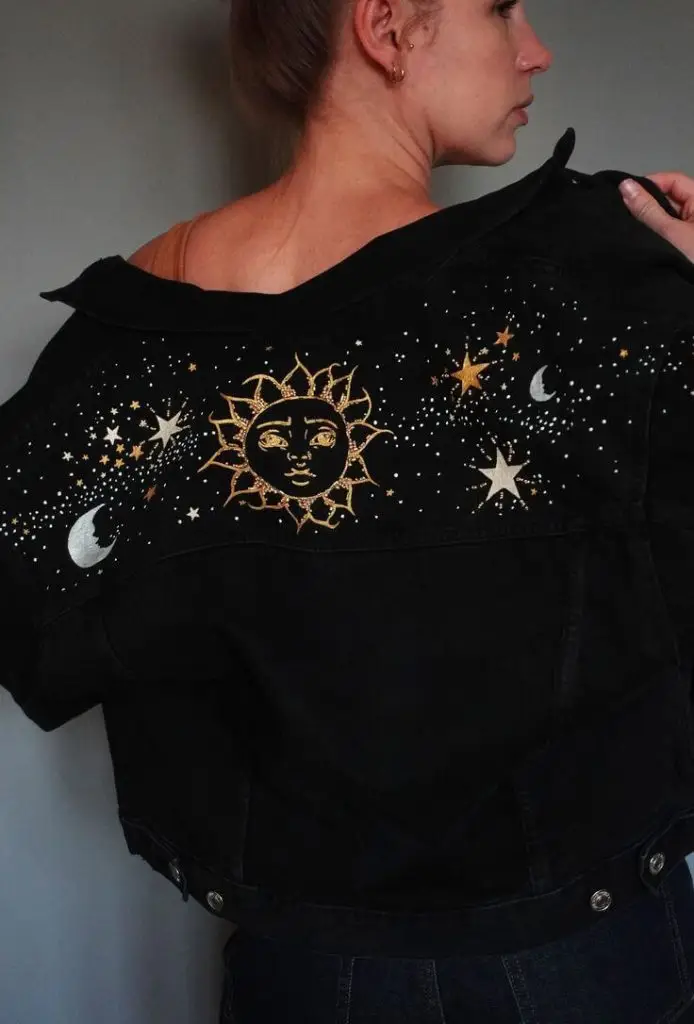Denim jacket with retro pin-up patches and bold accents