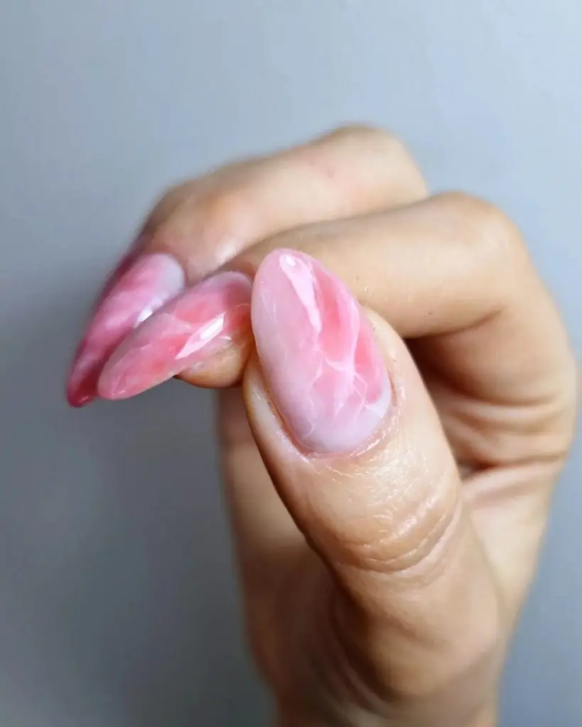 Marble Nail Design with Subtle Pink and White Tones