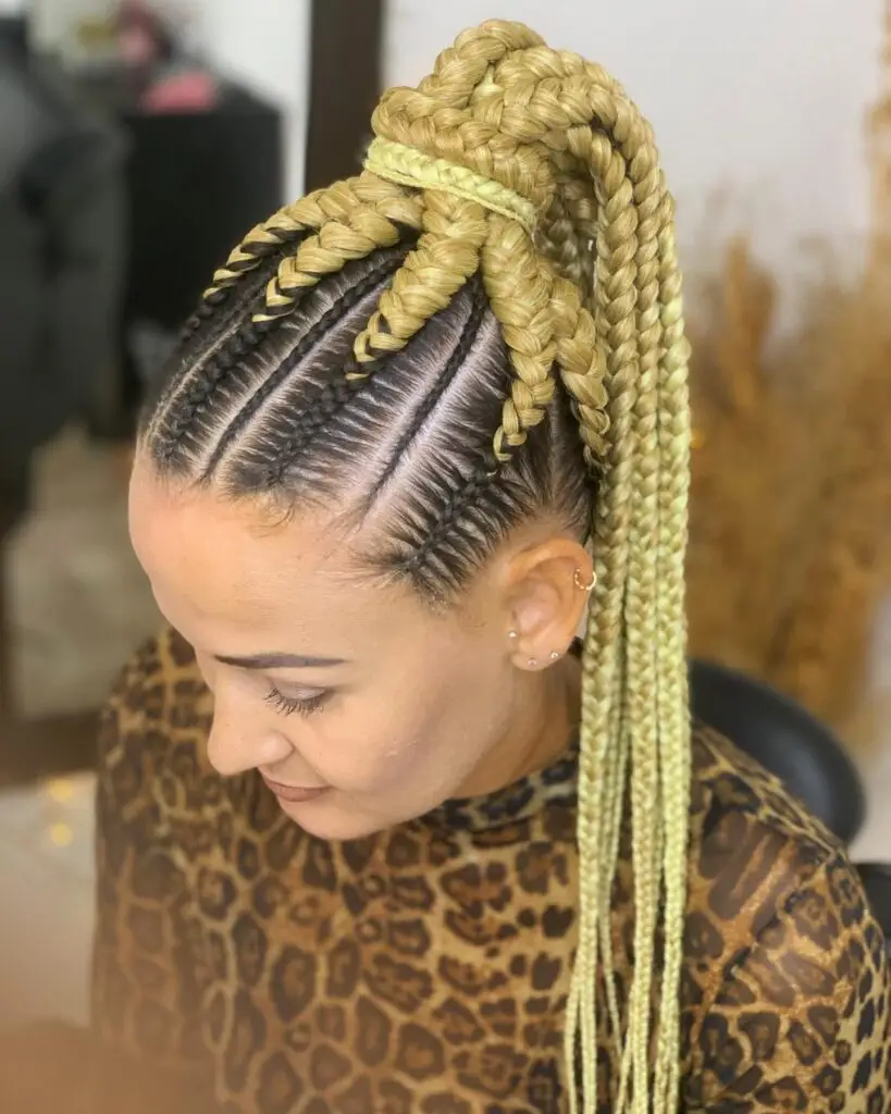 Side-swept goddess cornrows transitioning into loose twists for an asymmetric look