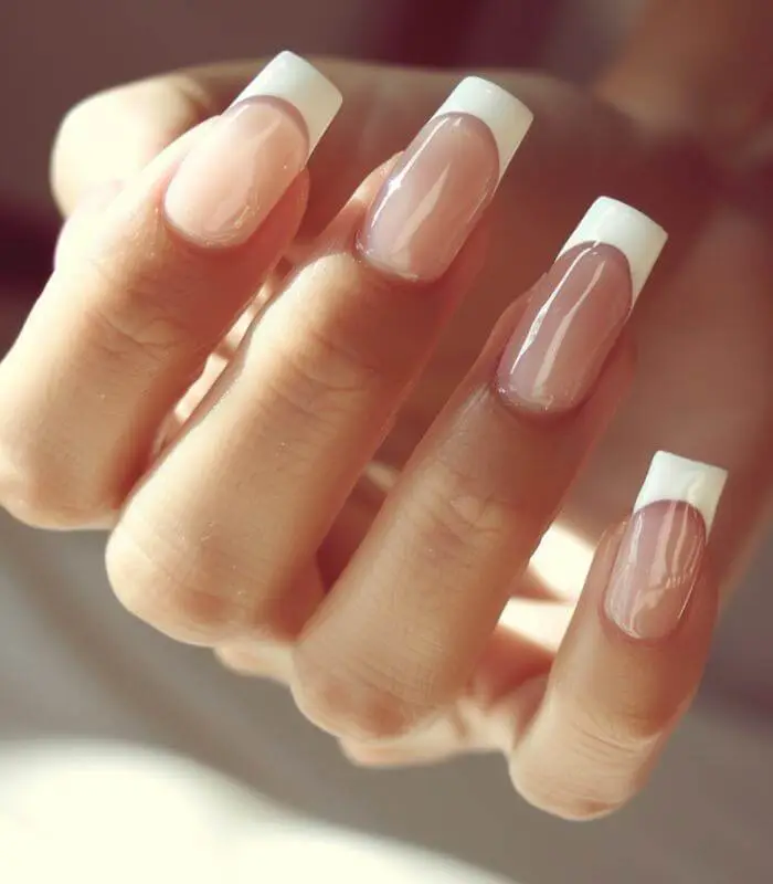 Classic Nude Nails with Gem Embellishments