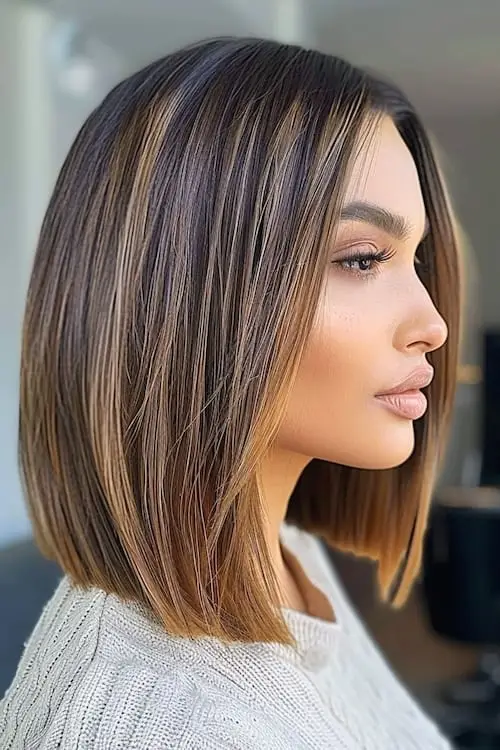 Chic lob with muted blonde highlights blending into light brown base