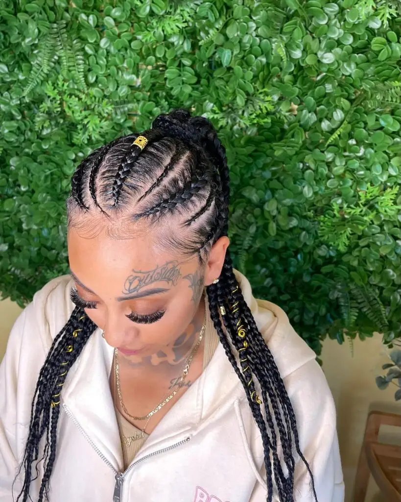 Goddess cornrows forming geometric patterns with chunky accessories