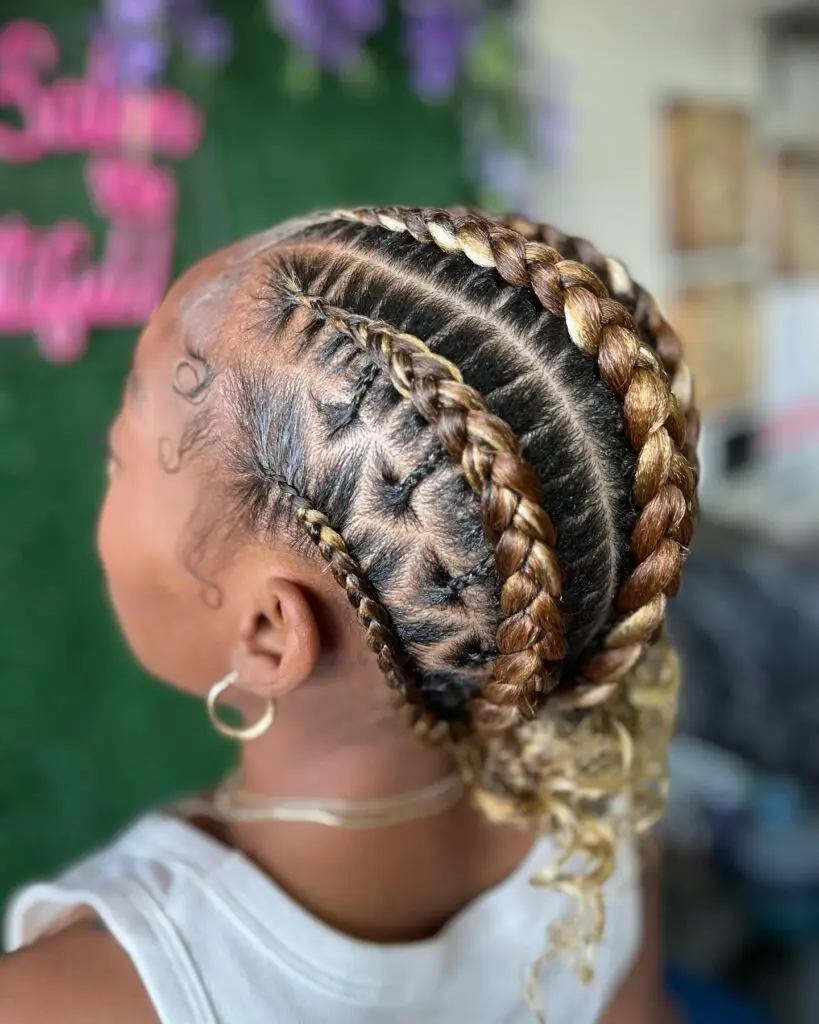 Goddess cornrows styled into symmetrical double buns