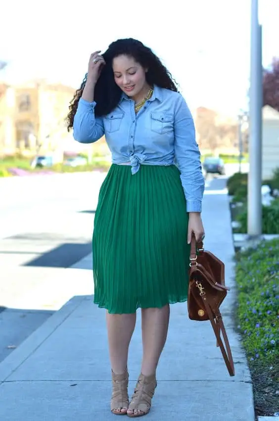 Knitted green duster layered over jeans and a white tank for a Saint Patrick's Day look