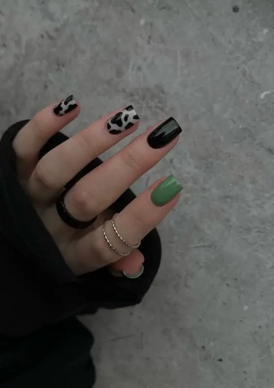 Glamorous Black Gel Nails With Gold Heart Detailing