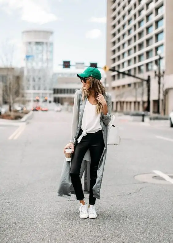 Saint Patrick's Day outfit with a green knitted sweater and black jeans