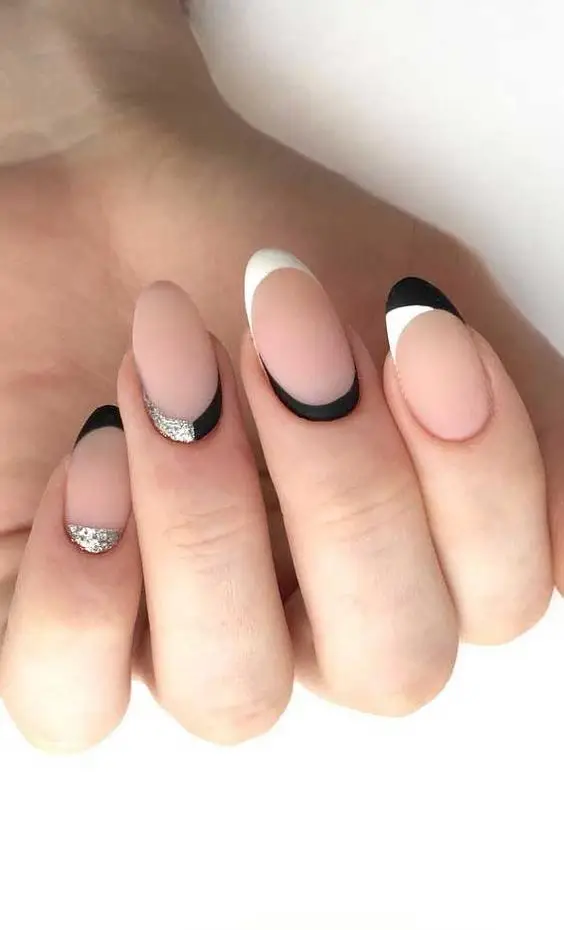 Matte black nails with bold red foil details