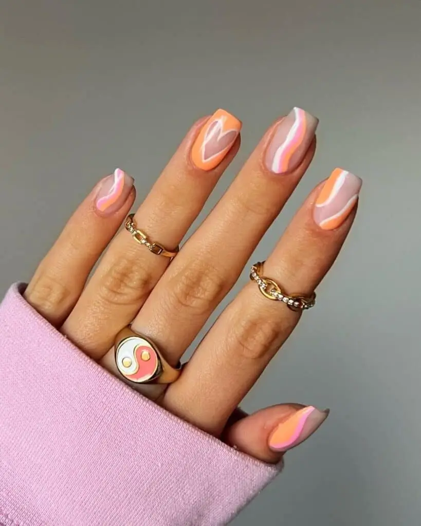 Vibrant Orange Valentine’s Nails with Whimsical Design