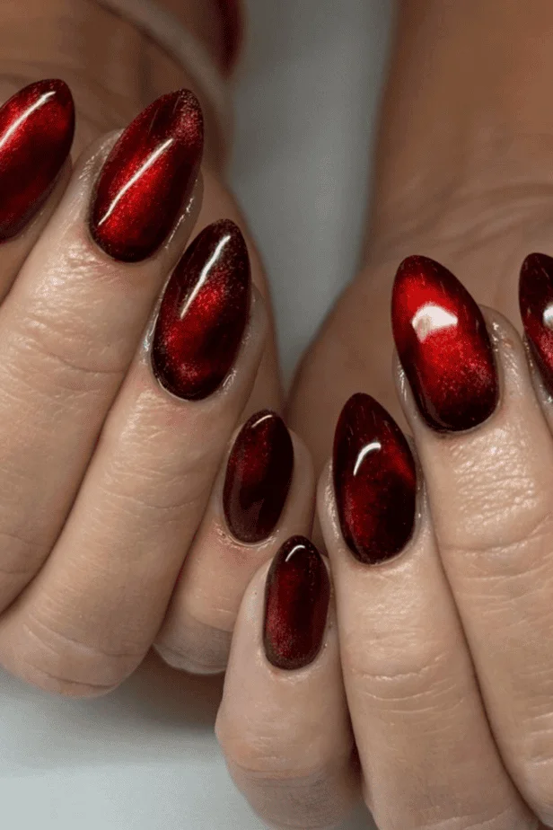 Extra-long glossy red Valentine’s Day nails with a dramatic flair