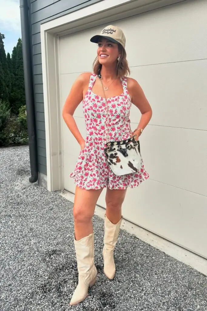 Woman in a blouse with statement sleeves, metallic skirt, and cowboy boots