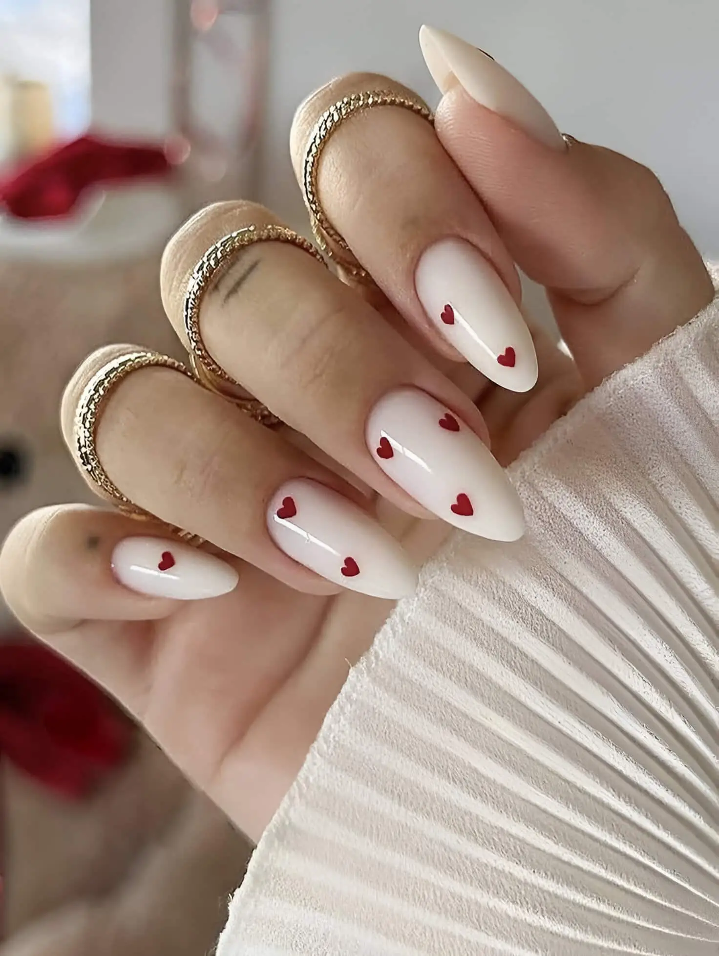 White Valentine’s nails with intricate 3D floral designs
