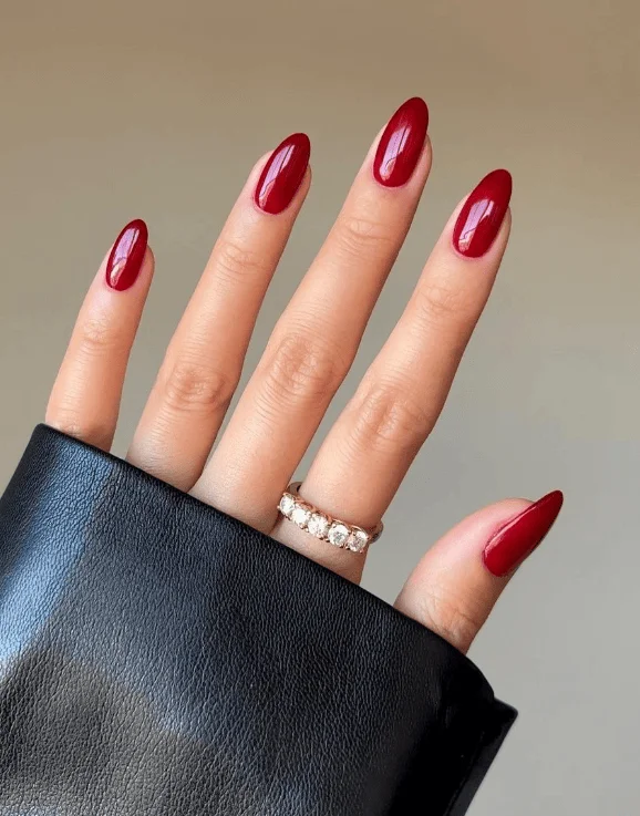 Glossy red nails with glitter stripe accents for Valentine’s Day