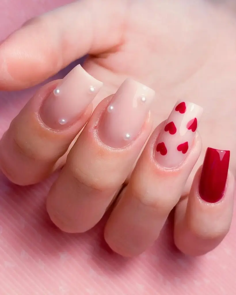 Delicate Valentine’s Nails with Heart Additions