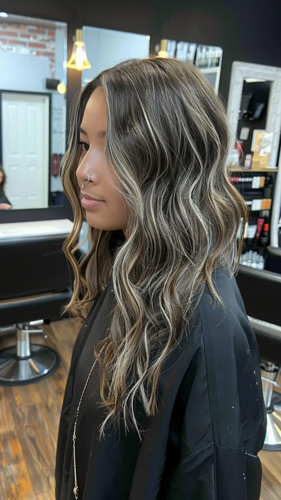 Dark brown hair with subtle ash blonde highlights blending seamlessly