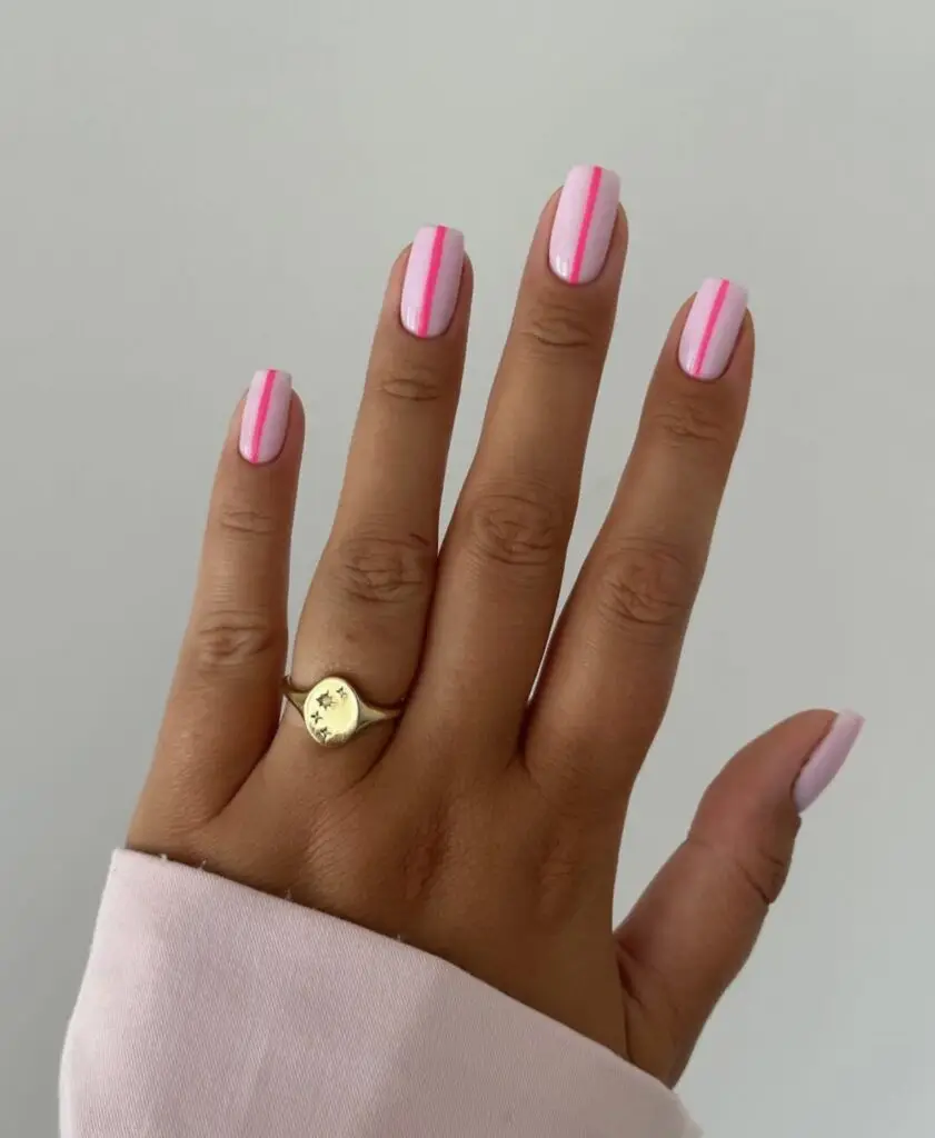 Rounded Barbie Pink Nails with Festive Elegance
