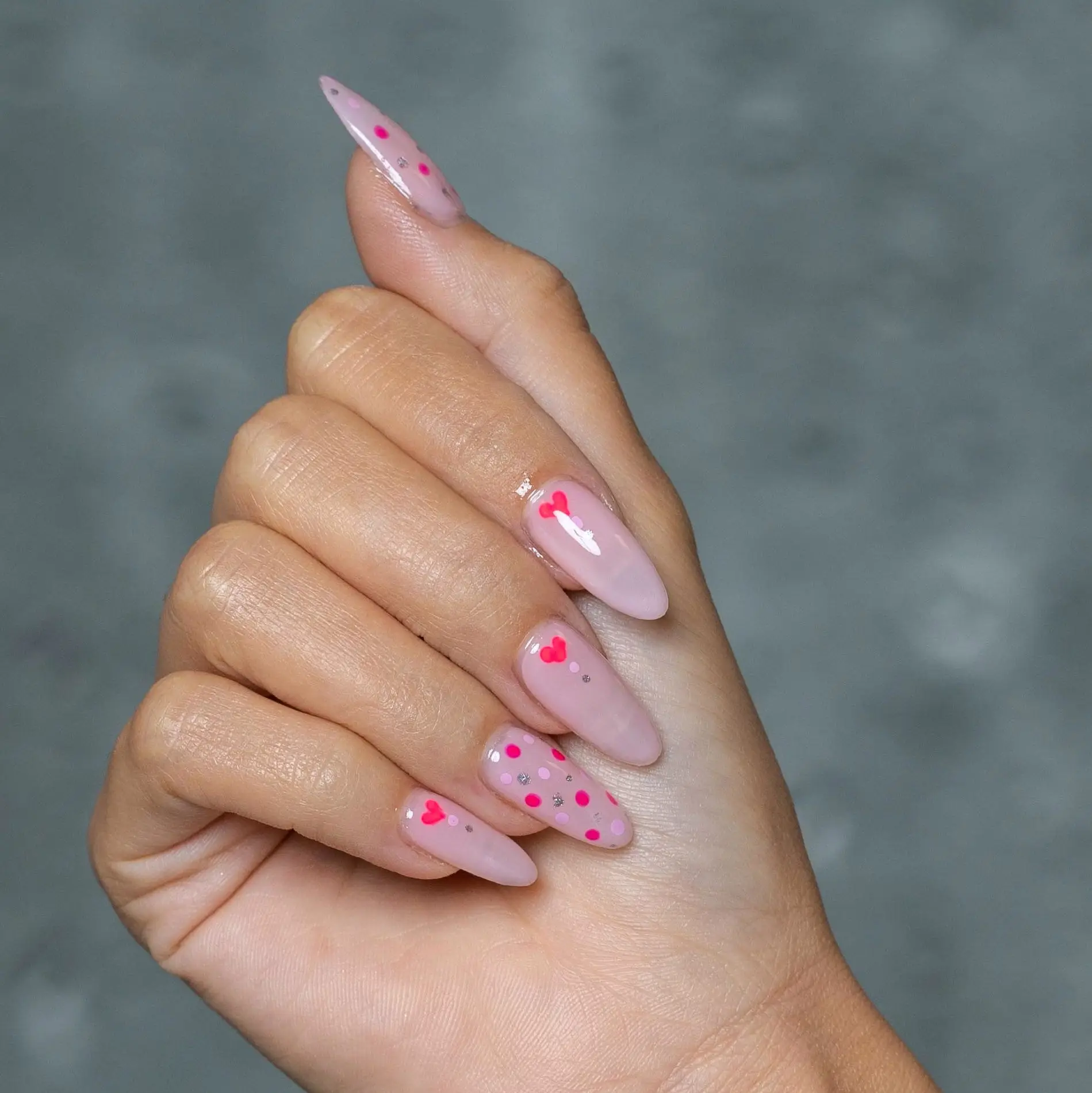Romantic Valentine Nail Design with Glittering Hearts