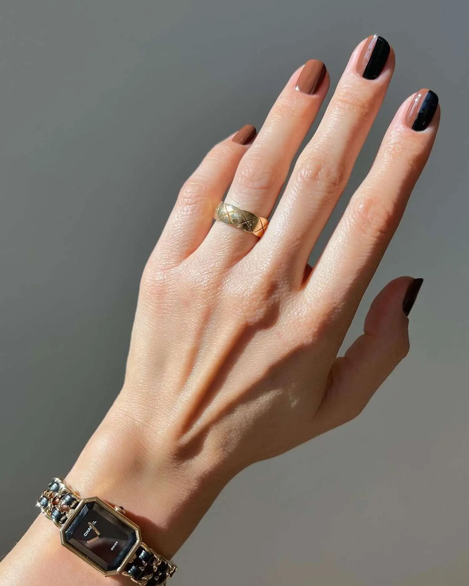 Negative space Valentine’s Day nails with red tips and gold detailing