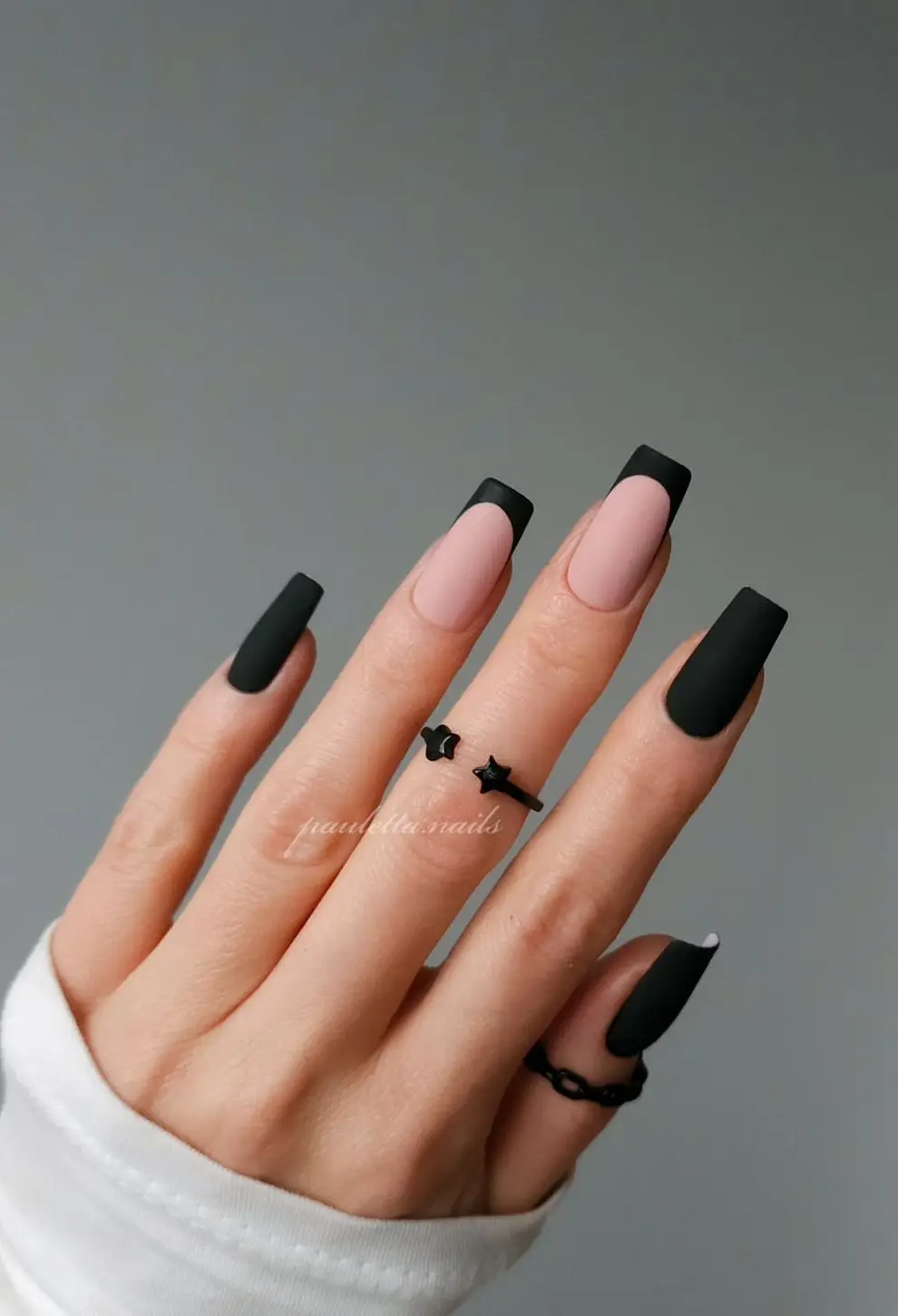 Black glitter nails with bold red heart accents