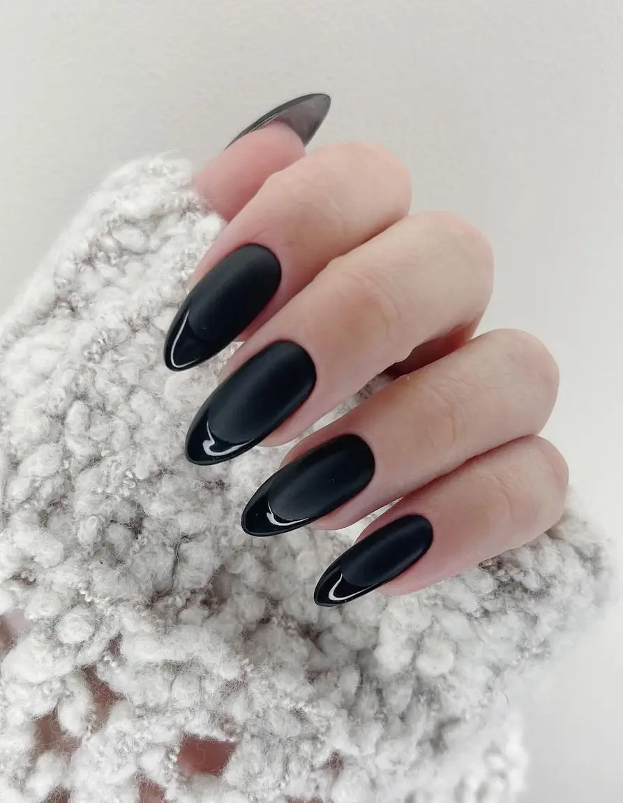 Glossy black nails with deep burgundy velvet accents