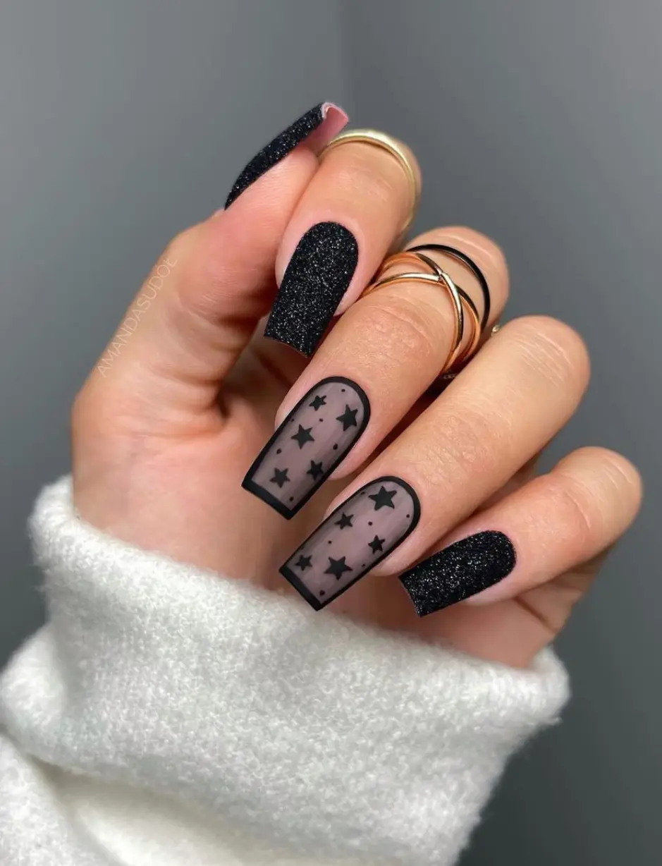 Glossy black nails with a clean and timeless look
