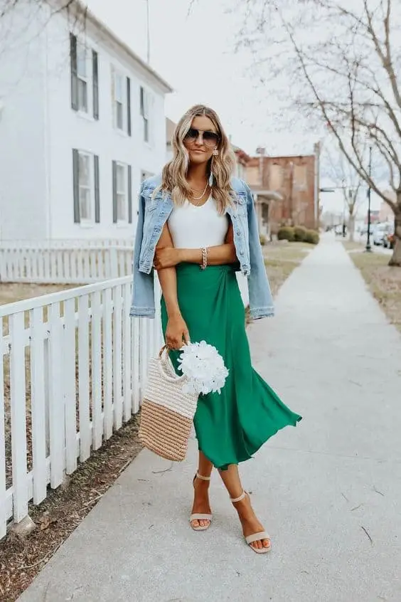 Oversized knit sweater in forest green paired with leggings for a cozy look