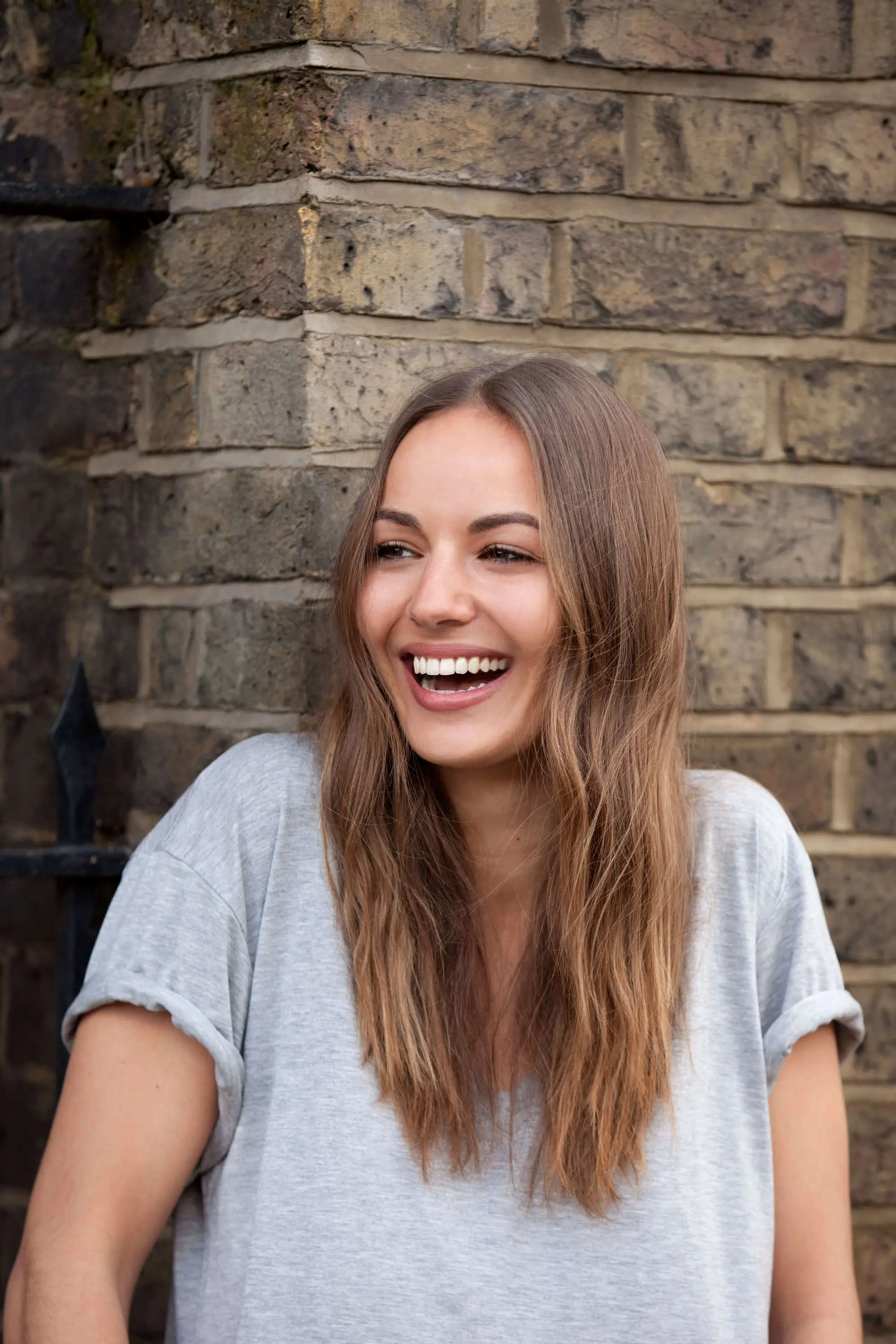 Loose waves with golden-caramel highlights on brown hair