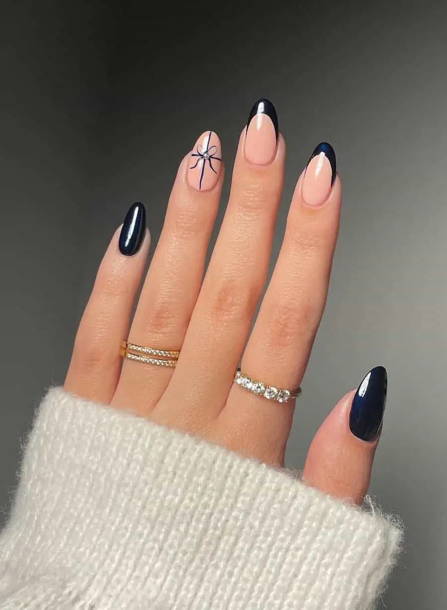 Snowy winter-inspired nails with white and silver detailing
