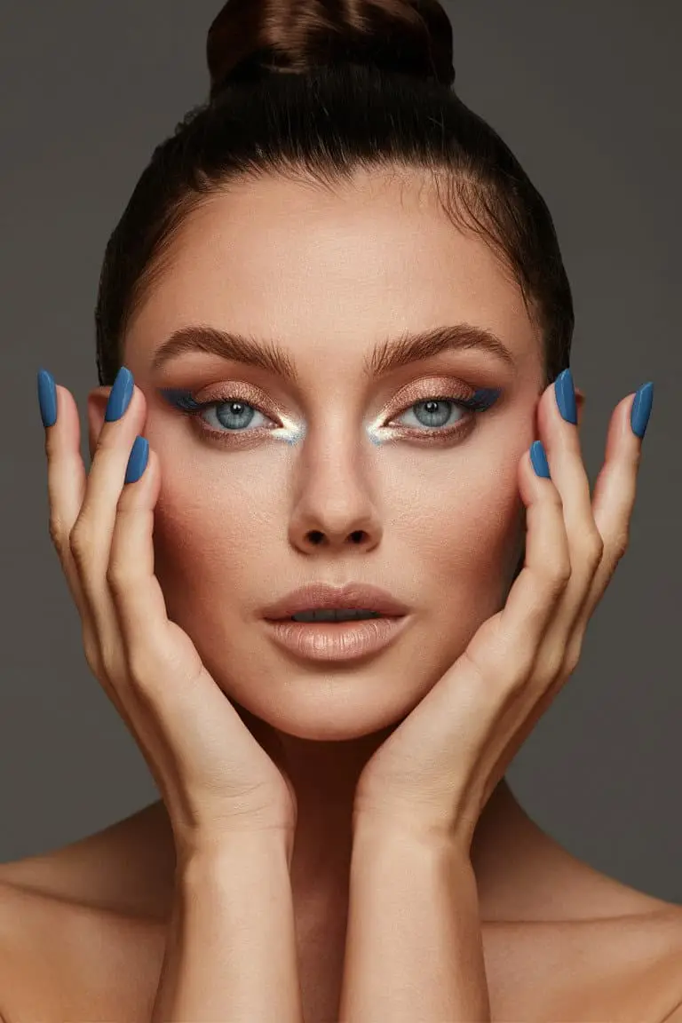 Close-up of blue eyes with shimmering metallic eyeshadow