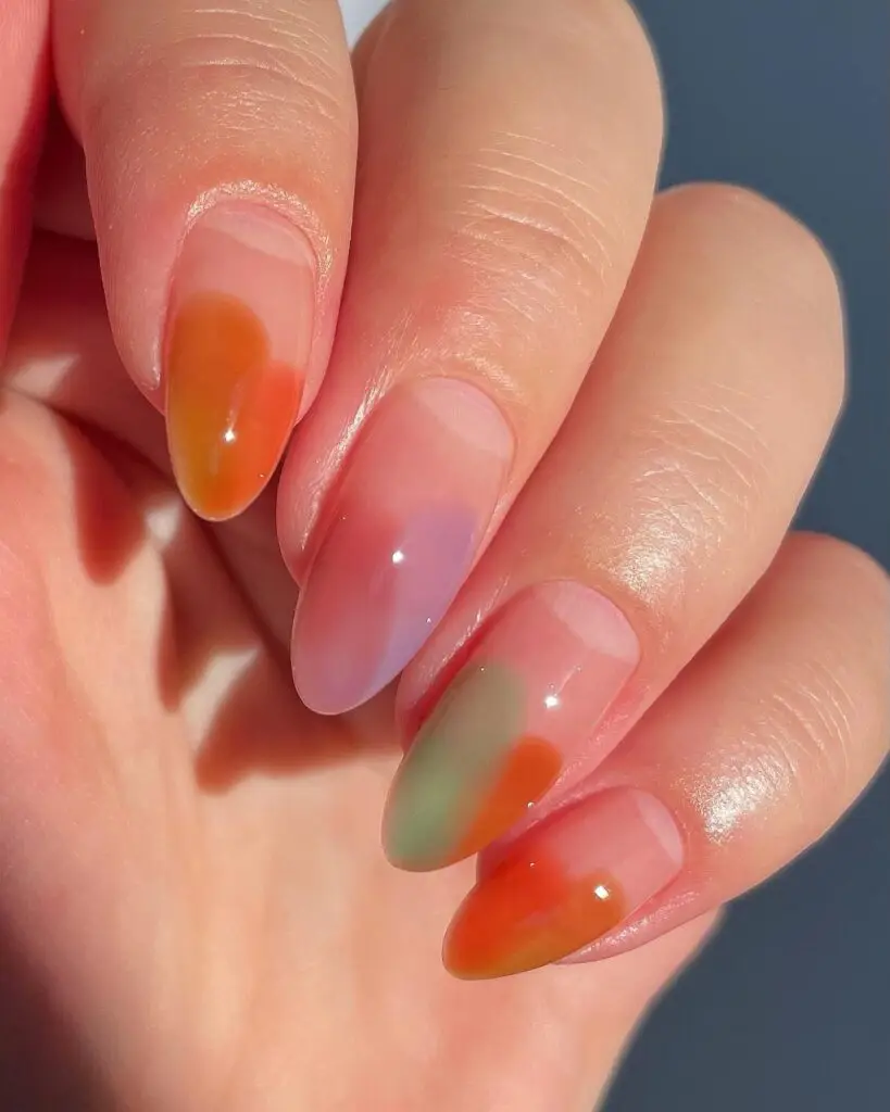 Fall-inspired jelly nails with translucent orange hues