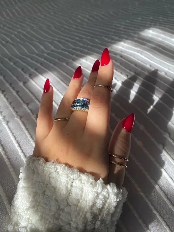 Full red Valentine’s nails with glossy, bold tones