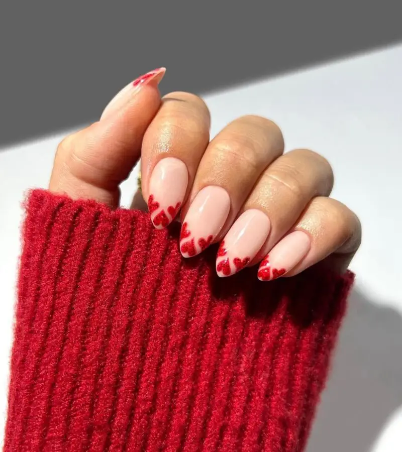 Soft Coral Nails with Glitter Heart Embellishments