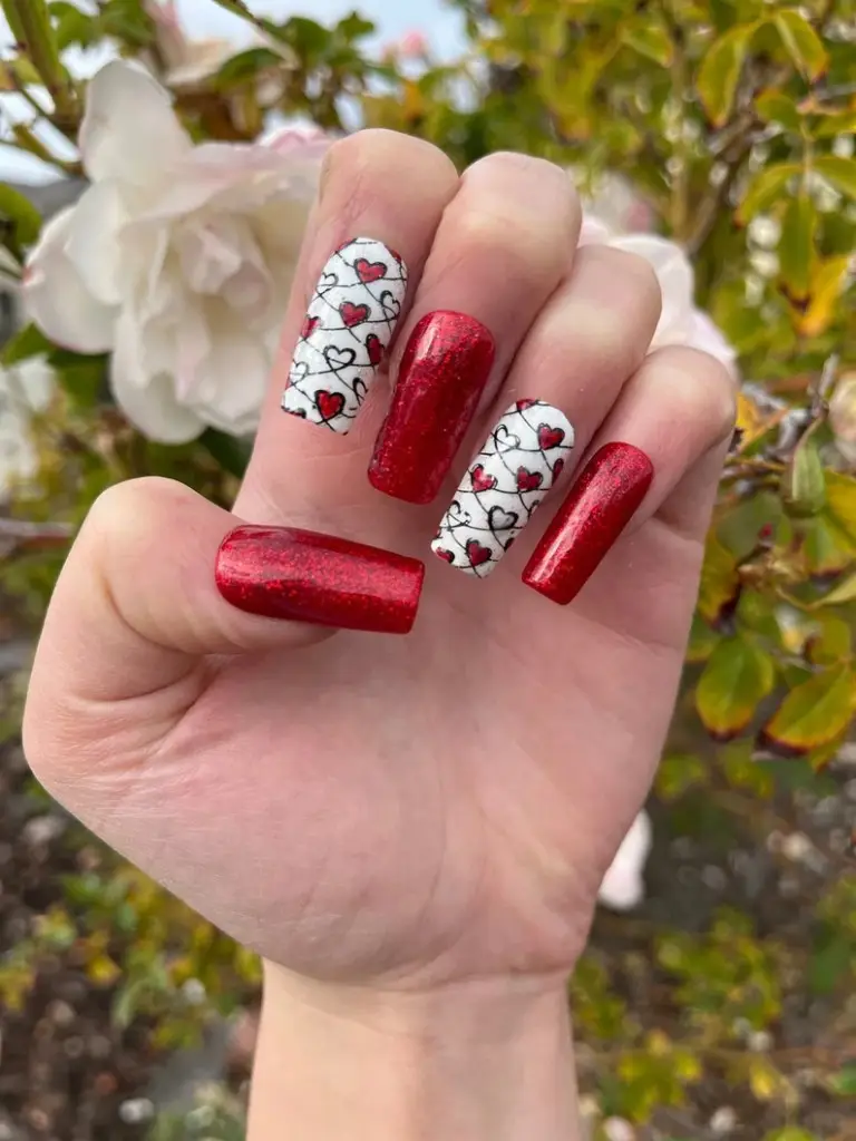 Soft Pink Valentine Nails with Minimalist Heart Accent