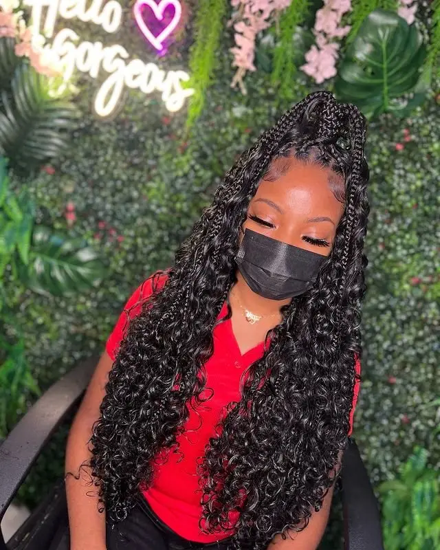 Goddess cornrows with spiral braid details and intricate parting