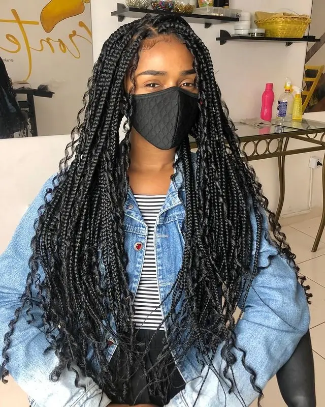 Layered goddess cornrows with dynamic feed-in braid transitions