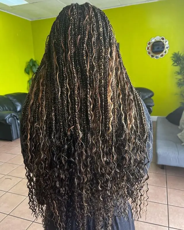 Goddess cornrows styled into a neat, high-top braided bun
