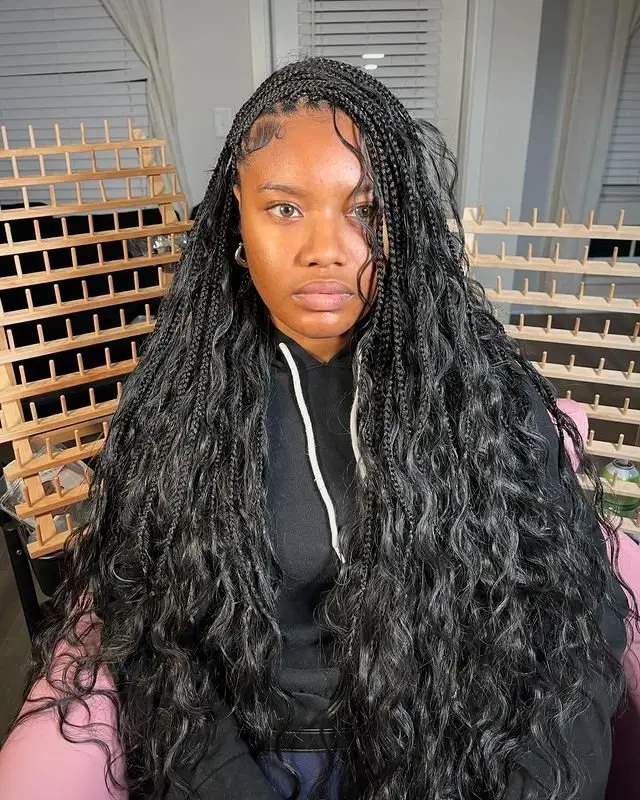Goddess cornrows featuring intricate star-shaped parting design