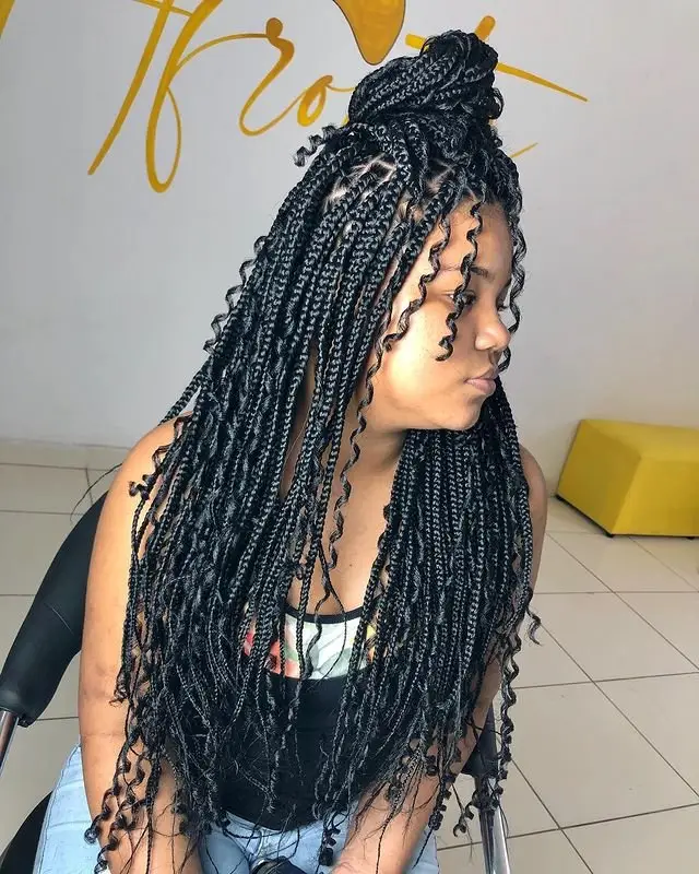Goddess cornrows styled into a low ponytail for an elegant and understated look