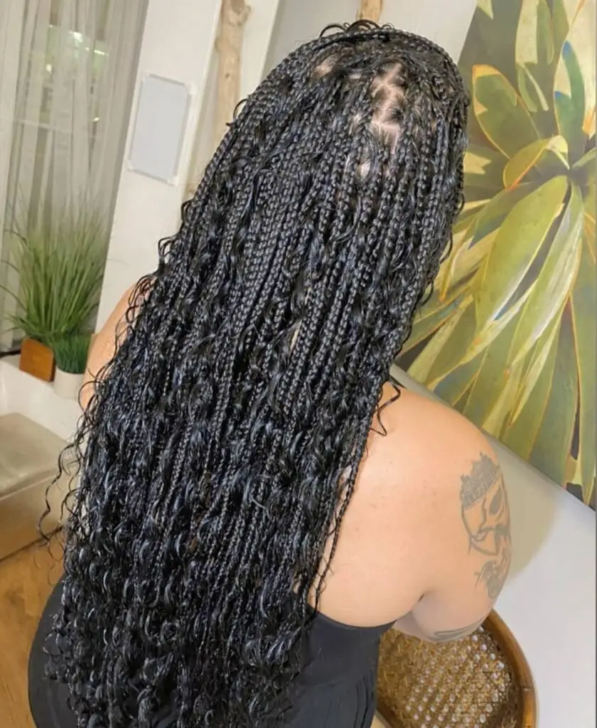 Goddess cornrows styled into an oversized braided bun